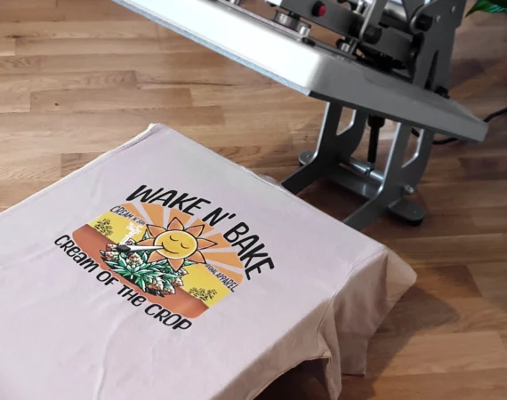 Cream Of The Crop Collective Wake N' Bake T-Shirt on heat press